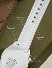 Crisp white rubber strap for MoonSwatch Mission to the Moonphase, showcasing reinforced buckle holes and clean stitching